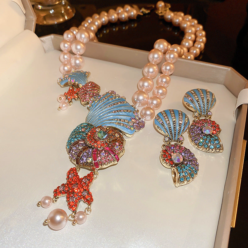 Collier & boucles d’oreilles coquillage perlé – trésor des abysses