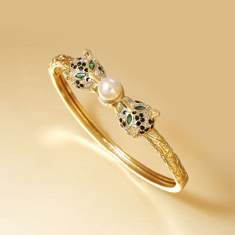 Bracelet Félins d’Or & Perle – Éclat Rétro