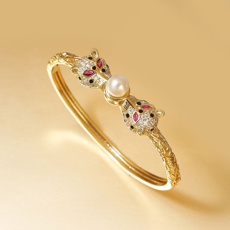 Bracelet Félins d’Or & Perle – Éclat Rétro
