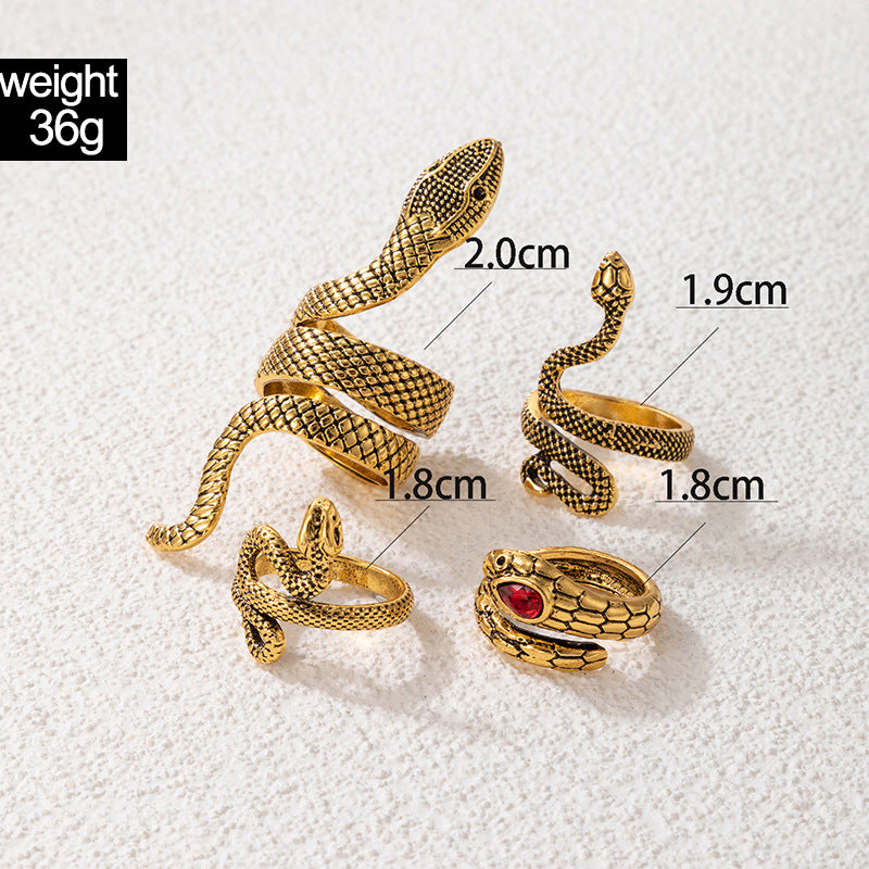 Set de 4 Bagues Serpent Or Vieilli & Rubis Pourpre – Serpents Sacrés