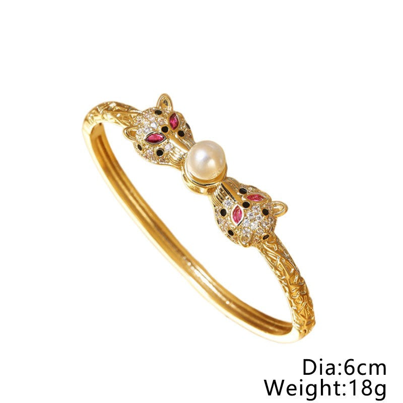 Bracelet Félins d’Or & Perle – Éclat Rétro