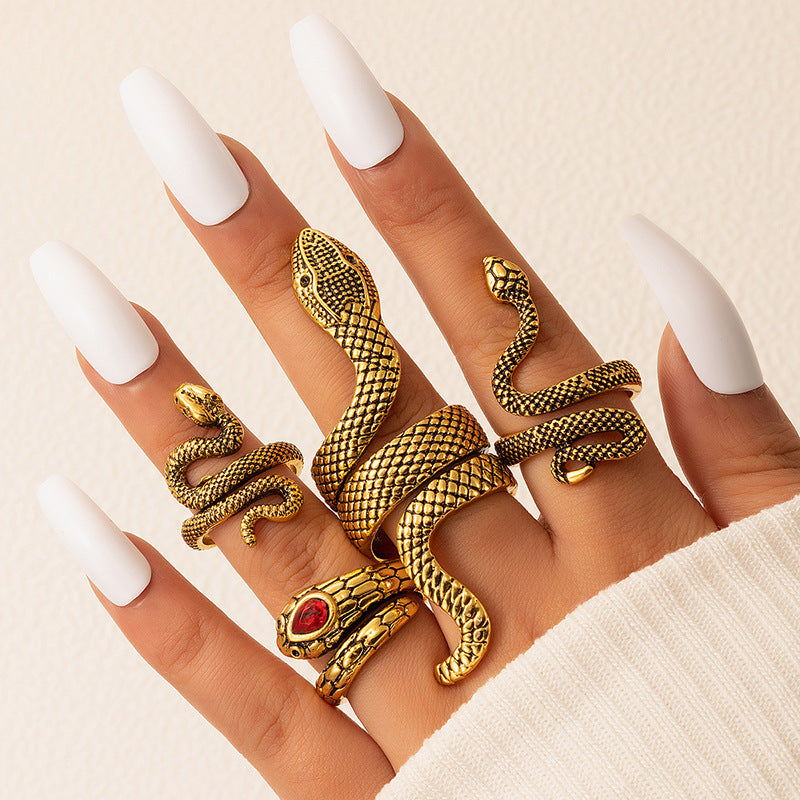 Set de 4 Bagues Serpent Or Vieilli & Rubis Pourpre – Serpents Sacrés